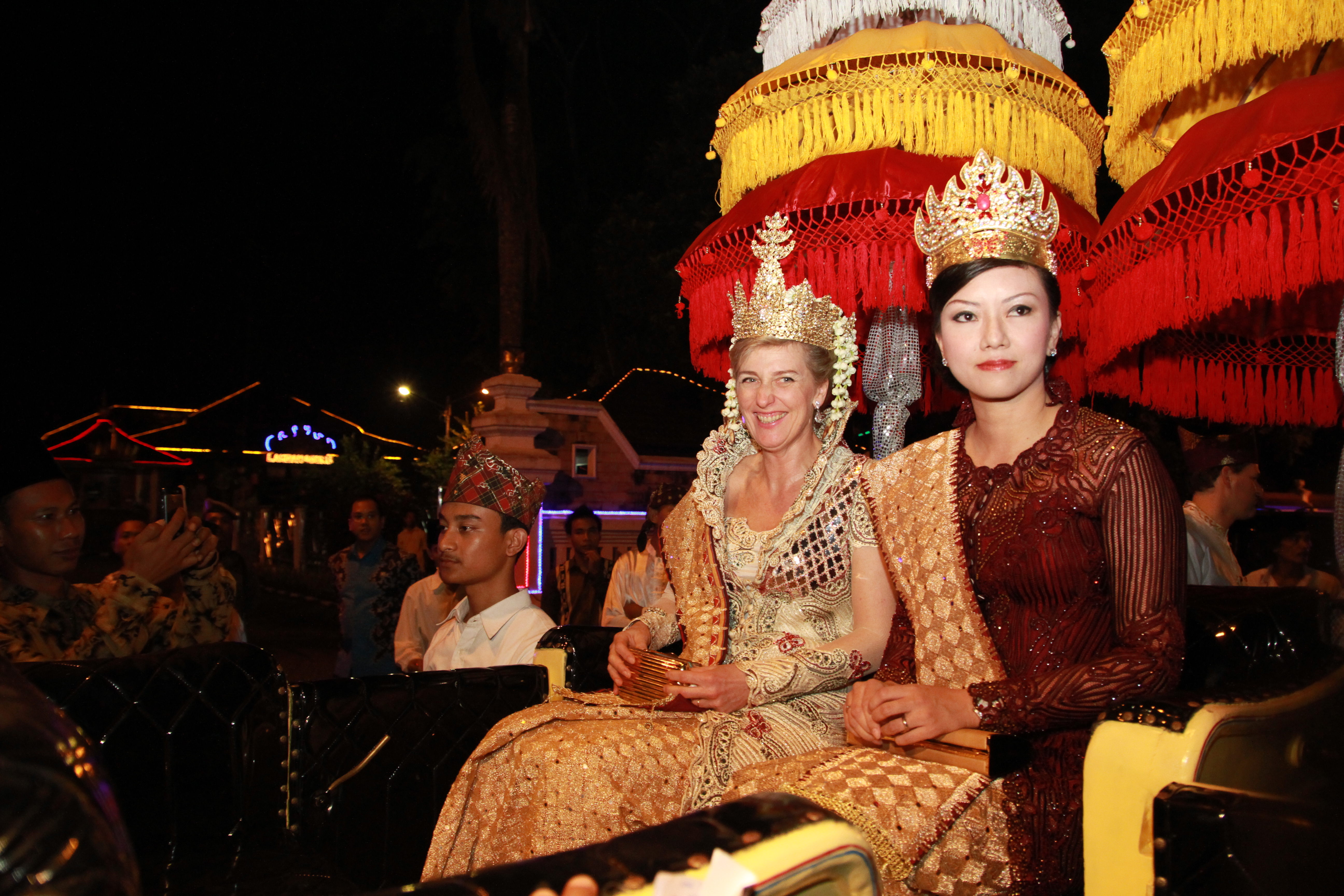 20120414 - JAKARTA, INDONESIA: This handout picture, distributed on Saturday 14 April 2012, shows Belgian Princess Astrid, Special Representative to the Roll Back Malaria Partnership, wearing a traditional dress as she sits next to Mrs Pitka Menoza, cife of the vice-governor, during a traditional ceremony to welcome Princess Astrid as a member of the community during a field visit to Bandar Lampung, with Roll Back Malaria (RBM), in Indonesia. RBM is a partnership of the World Health Organisation (WHO), UNICEF, the Global Fund and the Indonesia's Ministry of Health and aims at battling the spread of malaria. BELGA PHOTO HANDOUT ROLL BACK MALARIA